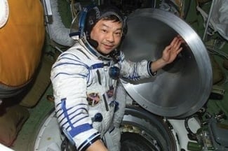 Astronaut with open hatch door
