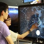visitors explore NUIverse display