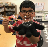 Boy holding large bubble
